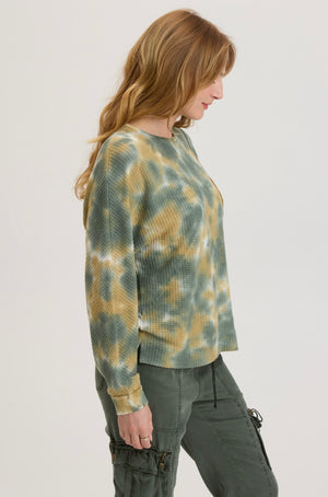 Rock a laid-back, groovy vibe with the XCVI Delsi. This tie-dye relaxed fit crew neck adds a playful touch to your wardrobe, while also offering a comfortable and effortless style. Perfect for those who want to stand out and have fun with their fashion choices.