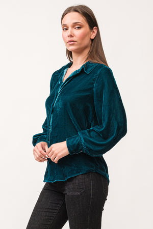 Experience casual sophistication with Dear John's Mirabelle top. Featuring a flattering V-neck, long sleeves, and convenient button-up design, this top is not only stylish but also easy to care for with its machine washable fabric. Take your wardrobe to the next level with this versatile and effortless top.