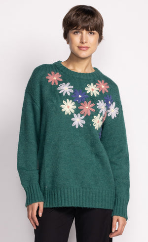 Get cozy and stylish with the Pink Martini Layton sweater, featuring delicate embroidered flowers for a touch of whimsy. Perfect for adding a pop of color and personality to any outfit!