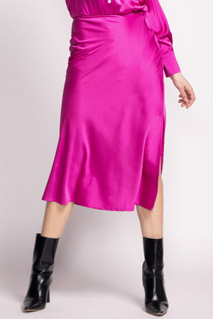 Slip into chic comfort with Pink Martini's Lena skirt. This silky midi skirt effortlessly glides with your every move, providing a touch of luxury to any outfit. Say goodbye to feeling restricted in other skirts, and hello to unrestricted style with Lena.