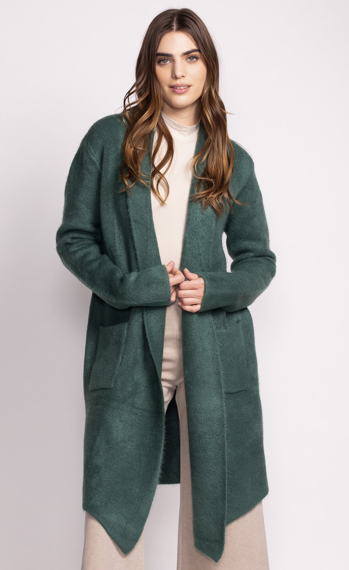 Our bestseller the Stockport is an oversized cardigan-like jacket that hits below the knee. It's a versatile piece that's bound to keep you warm at the office as well as when you run errands.