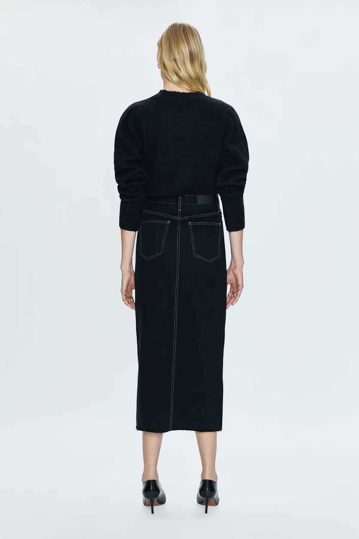 Of-the-moment, yet eternally stylish - our best selling skirt features an elongated midi length and five pocket denim design notes. Crafted from rigid denim without stretch for sophisticated fit and fall, with a well considered front skirt slit for ease of movement. Noir is deeply saturated black washed denim with vibrant contrast stitching.