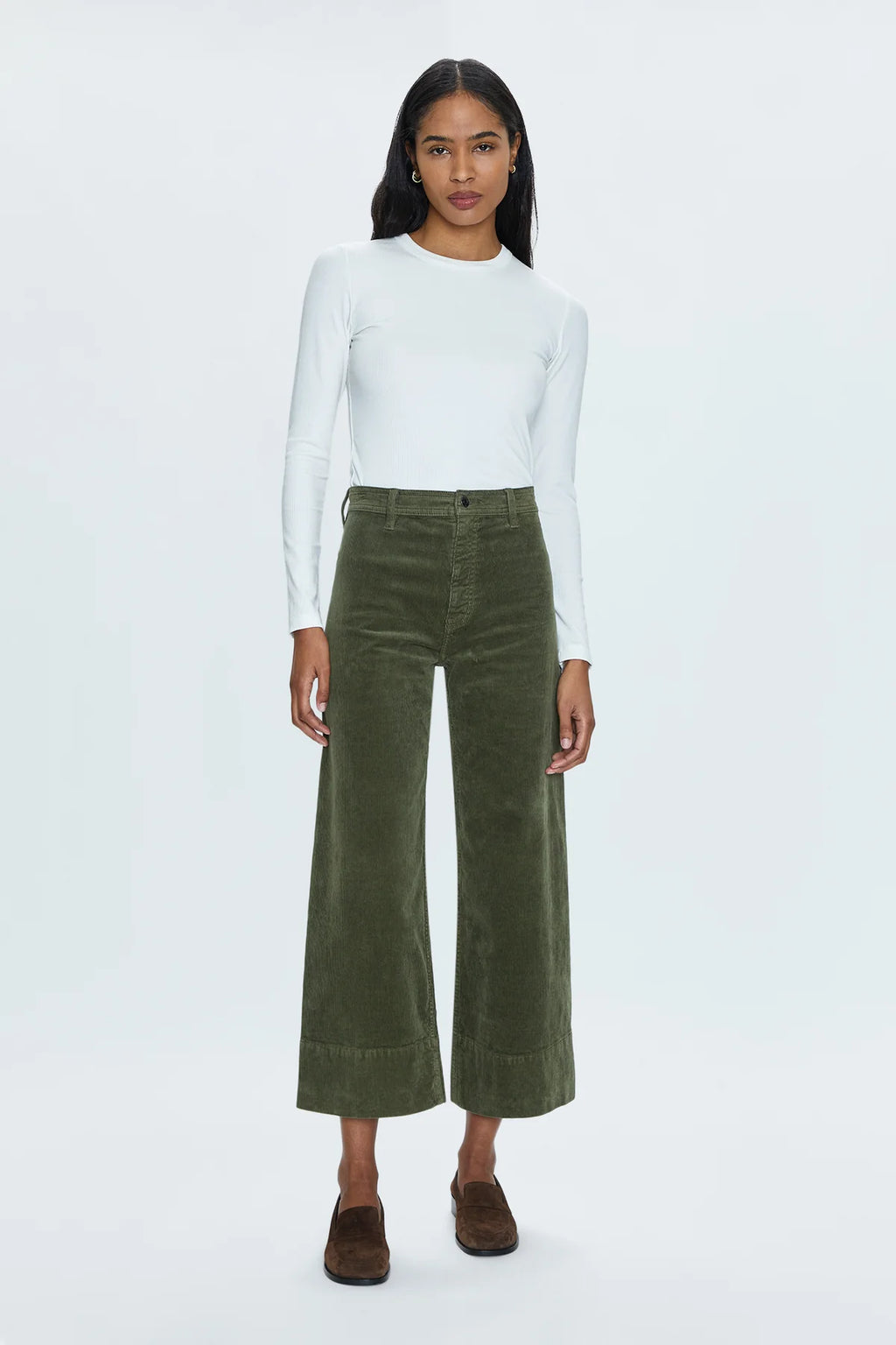 High rise waist, with a wide leg silhouette and a cropped, ankle length hemline. Crafted from a soft textured corduroy fabrication with our signature comfort stretch denim. Finished with a double stitched waistline and wide cuffed hems. Martini is a warm, deep olive green colorway with a subtle sheen.&nbsp;