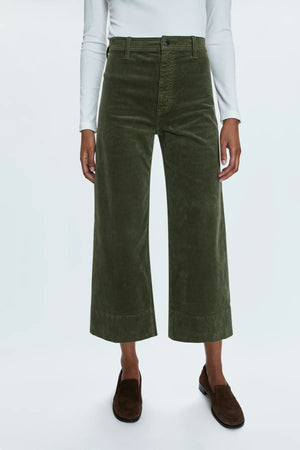 High rise waist, with a wide leg silhouette and a cropped, ankle length hemline. Crafted from a soft textured corduroy fabrication with our signature comfort stretch denim. Finished with a double stitched waistline and wide cuffed hems. Martini is a warm, deep olive green colorway with a subtle sheen.&nbsp;