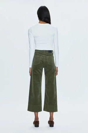 High rise waist, with a wide leg silhouette and a cropped, ankle length hemline. Crafted from a soft textured corduroy fabrication with our signature comfort stretch denim. Finished with a double stitched waistline and wide cuffed hems. Martini is a warm, deep olive green colorway with a subtle sheen.&nbsp;