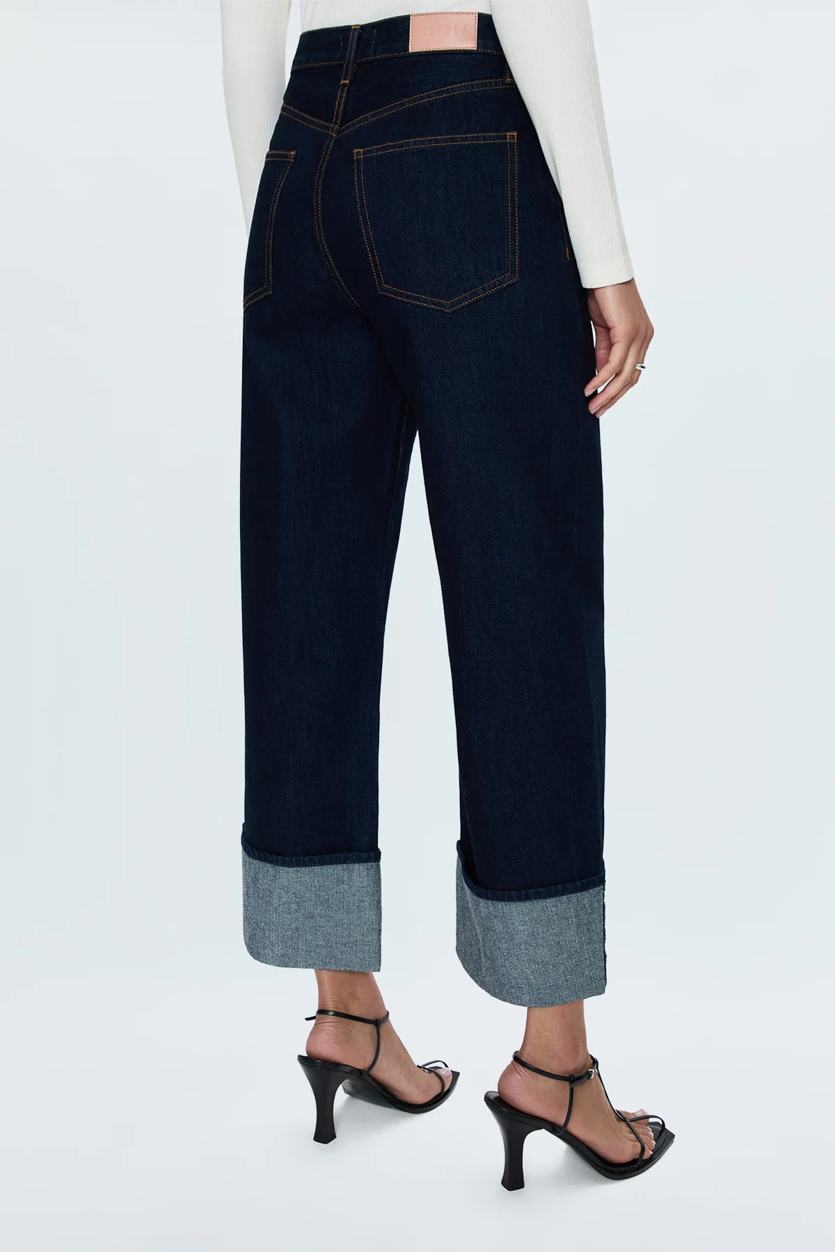 High rise waist with a relaxed, straight leg fit and an oversized cuffed ankle hem. Crafted from rigid, lightweight denim without stretch for an expert fit that holds its shape. Countdown is a deep indigo rinse wash denim with contrast stitching and copper toned hardware.&nbsp;