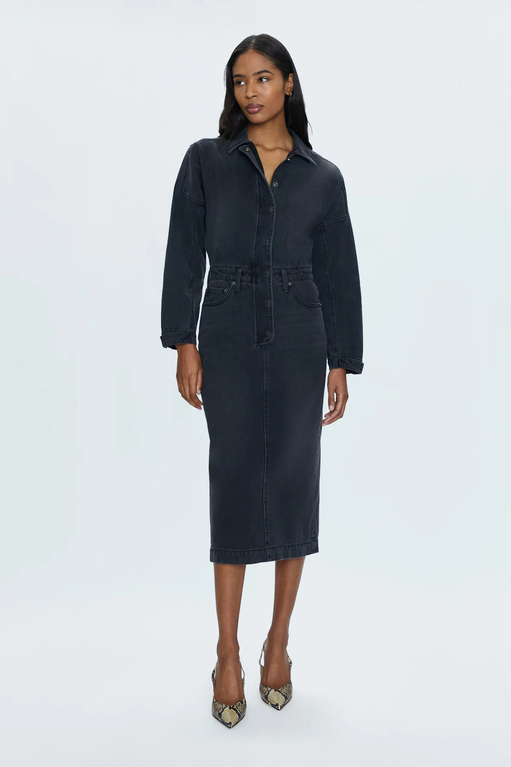 Rigid denim dress with a midi length skirt, designed with a dropped, dollman sleeve silhouette. 