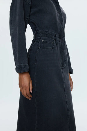 Rigid denim dress with a midi length skirt, designed with a dropped, dollman sleeve silhouette. 