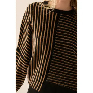 Get ready to howl at the moon in the Promesa Moonsmoke sweater! This striped round neck sweater features an asymmetrical hem, perfect for adding some unique flair to your outfit. Stay cozy and stylish with this must-have piece