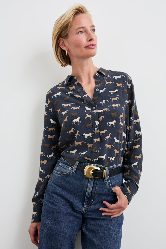 This classic design features a playful, stylish animal print mixed with a luxe, elevated fabrication to create a timelessly polished look. Made from washed silk, this button-down tailored top features a single front pocket.