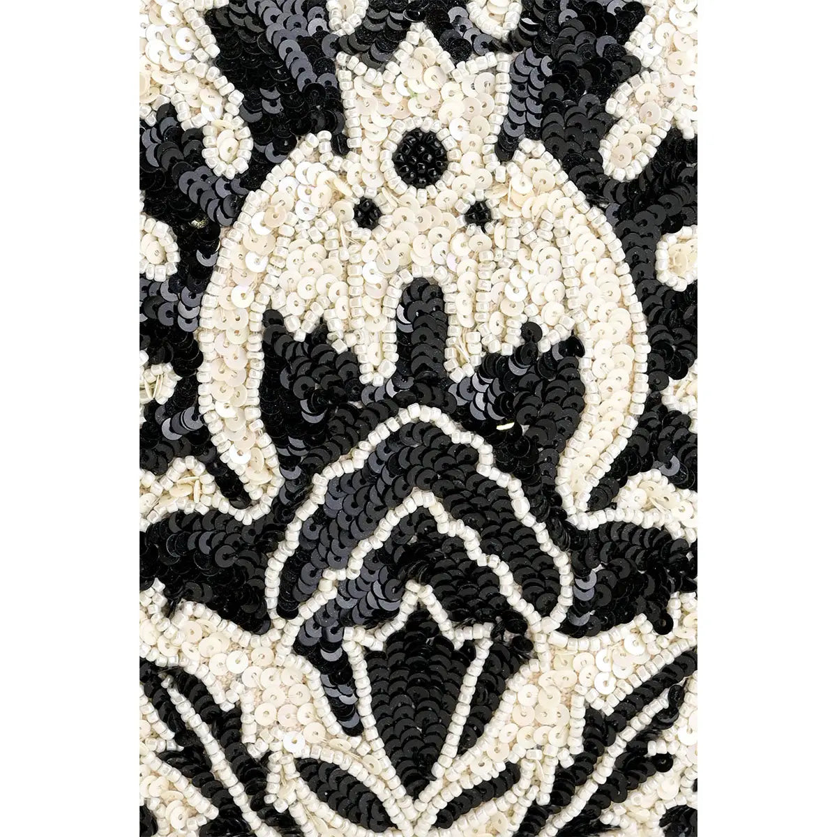 Black and white patterned fabric with a central design