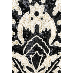 Black and white patterned fabric with a central design