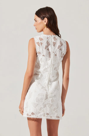 This playful crochet lace mini dress features a sleeveless design and a charming scalloped neckline, perfect for adding a flirty touch to your summer wardrobe. Its delicate texture and flattering cut make it ideal for sunny days and casual outings.