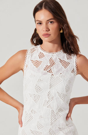 This playful crochet lace mini dress features a sleeveless design and a charming scalloped neckline, perfect for adding a flirty touch to your summer wardrobe. Its delicate texture and flattering cut make it ideal for sunny days and casual outings.