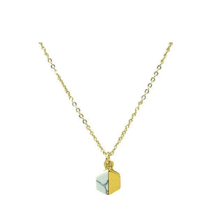 Add some spice to your style with Athena Designs' Spicy necklace featuring a tiny howlite and gold hexagonal charm. Perfect for adding a pop of color and geometric flair to any outfit. Get ready to turn heads and slay the fashion game.