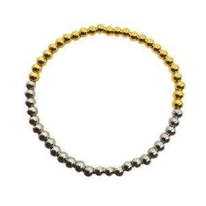 Two-tone beaded bracelet on a white background