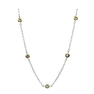 Get ready to dazzle with Athena Designs' Abby necklace! This two-tone plated chain will add a touch of elegance to any outfit, featuring bezel set CZ's for a touch of sparkle. Perfect for any occasion!