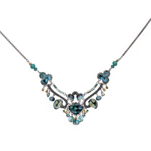 Necklace with blue and green gemstones on a white background