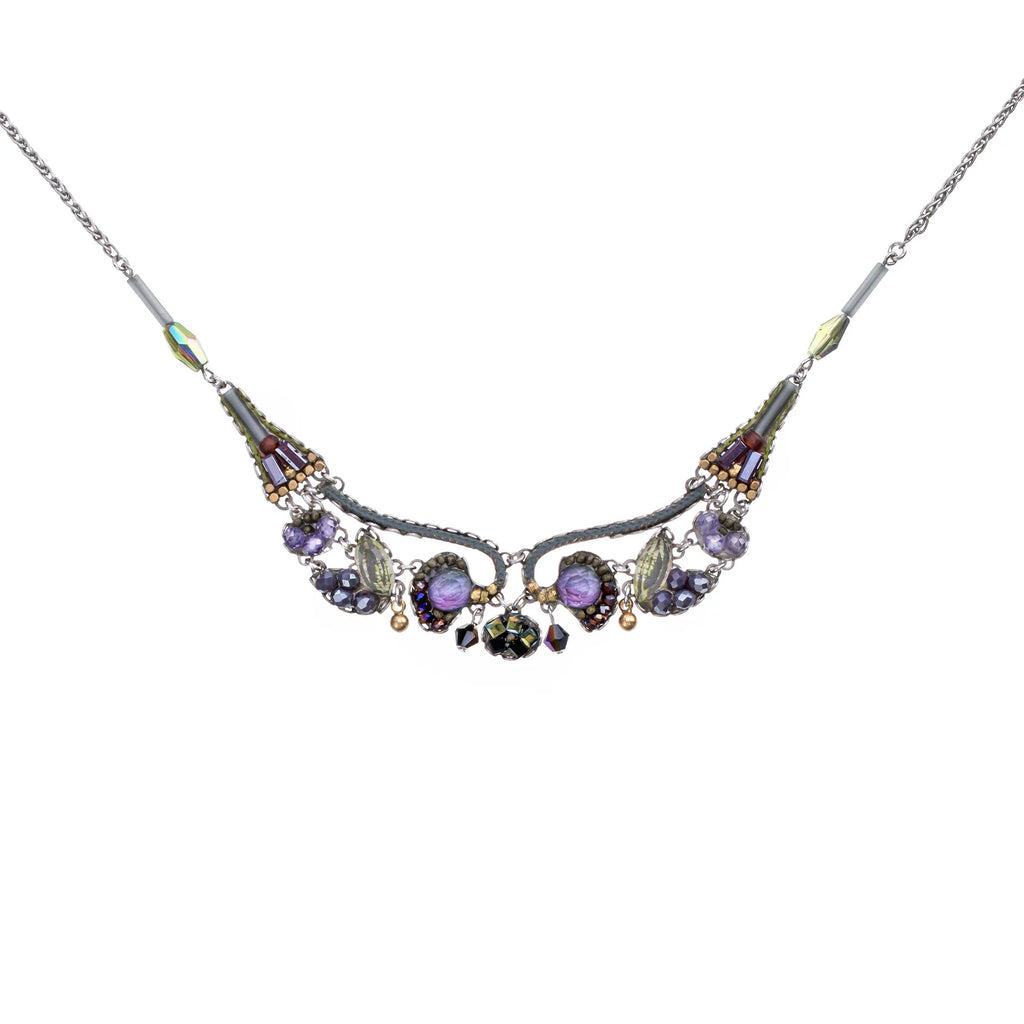 Necklace with purple and gold beads on a white background