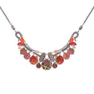 Brighten up your outfit with Ayala Bar's Violet necklace, featuring vibrant orange embroidery. Adds a playful pop to any look.