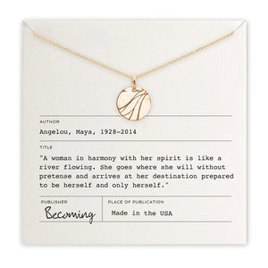 Gold necklace on a card with text and branding