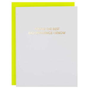 Greeting card with gold text 'You're the best bad influence I know' on a white background with a yellow border.