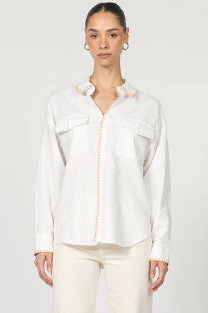 Wrap yourself in casual charm with the Dear John Adrianna button-up! This long sleeve beauty features eye-catching blanket stitching that adds a playful pop to your everyday wardrobe.