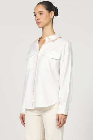 Wrap yourself in casual charm with the Dear John Adrianna button-up! This long sleeve beauty features eye-catching blanket stitching that adds a playful pop to your everyday wardrobe.