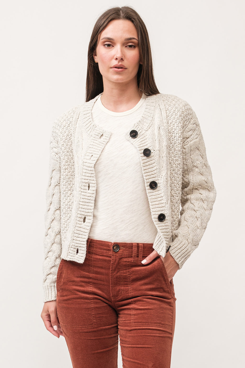 Get cozy this season in our Dear John Alma cable knit cardigan! With its trendy cable knit design, you'll be sure to stay warm and stylish. Perfect for those chilly autumn days, this cardigan is a must-have for any wardrobe. (Psst..it's also great for snuggling up with a good book!)