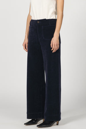 Navy wide-leg pants worn by a person on a white background