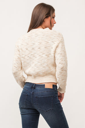 Indulge in the cozy and playful style of Dear John's Britney sweater. Made with space dyed yarn and a ribbed design, this sweater will keep you warm and stylish during chilly days. Embrace the quirky side of fashion with this unique and comfortable sweater.