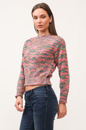 Indulge in the cozy and playful style of Dear John's Britney sweater. Made with space dyed yarn and a ribbed design, this sweater will keep you warm and stylish during chilly days. Embrace the quirky side of fashion with this unique and comfortable sweater.