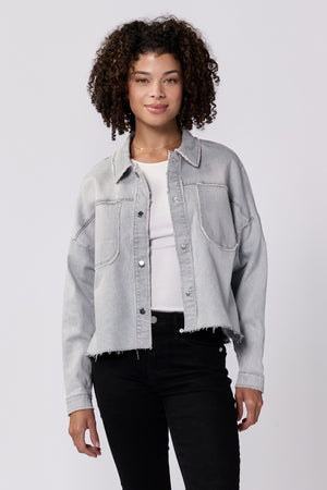 Meet your new favorite jacket, Dear John | Gina! This cropped boxy denim jacket is the perfect mix of style and comfort. Stay on trend with its unique silhouette, while staying cozy with its soft denim material. You won't be able to resist wearing it all the time!