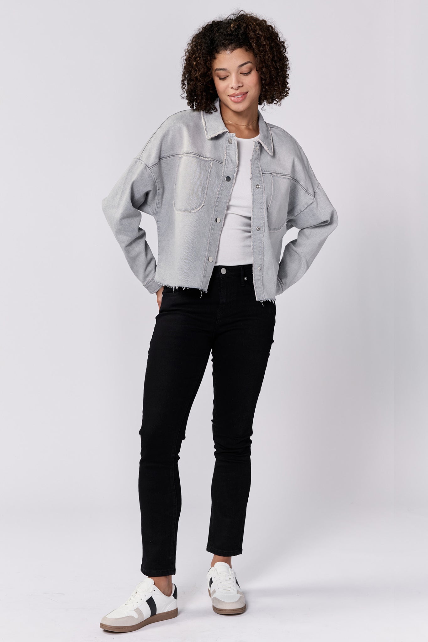 Meet your new favorite jacket, Dear John | Gina! This cropped boxy denim jacket is the perfect mix of style and comfort. Stay on trend with its unique silhouette, while staying cozy with its soft denim material. You won't be able to resist wearing it all the time!