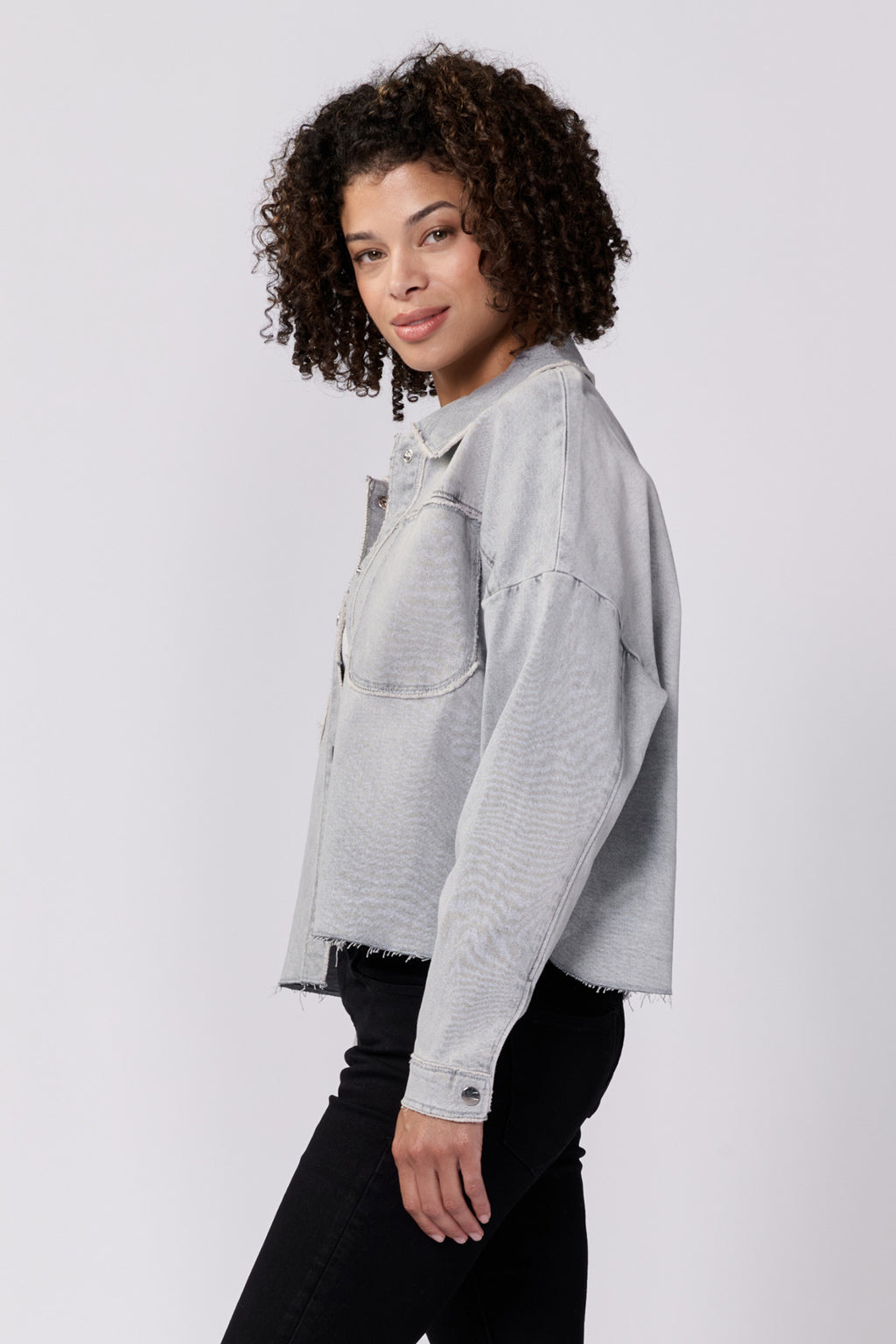 Meet your new favorite jacket, Dear John | Gina! This cropped boxy denim jacket is the perfect mix of style and comfort. Stay on trend with its unique silhouette, while staying cozy with its soft denim material. You won't be able to resist wearing it all the time!