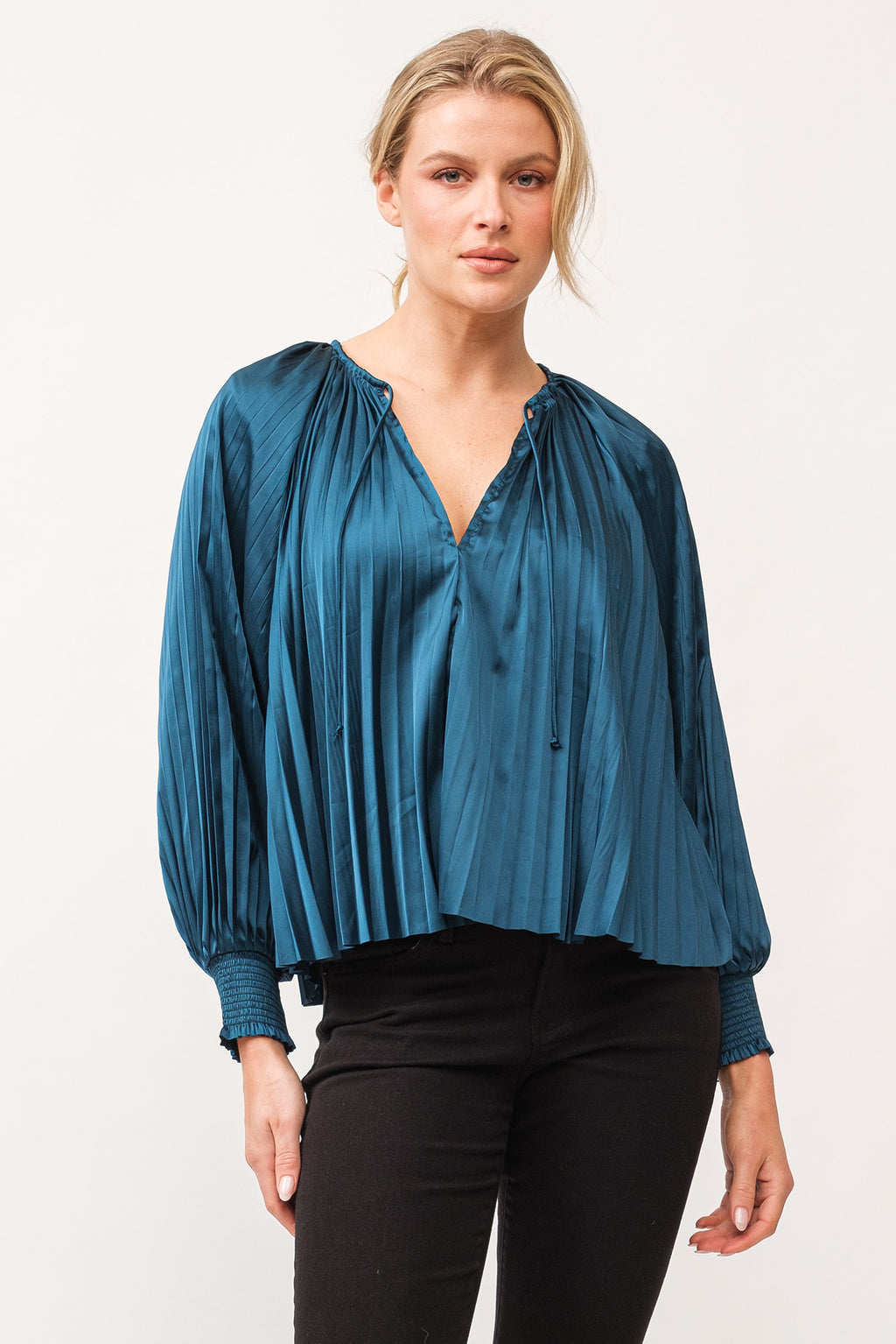 Introducing the Dear John Deletta top - a playful twist on the classic blouse. Featuring pleated satin for a touch of elegance, and ruched cuffs for a fun and stylish detail. This top is perfect for adding a unique touch to your wardrobe. (Elegance and fun all in one!)