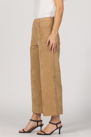 Person wearing tan pants on a plain background