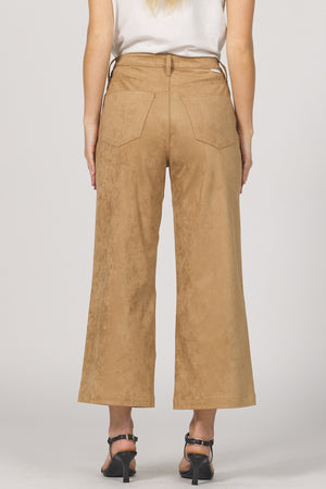 Tan wide-leg pants worn by a person on a plain background