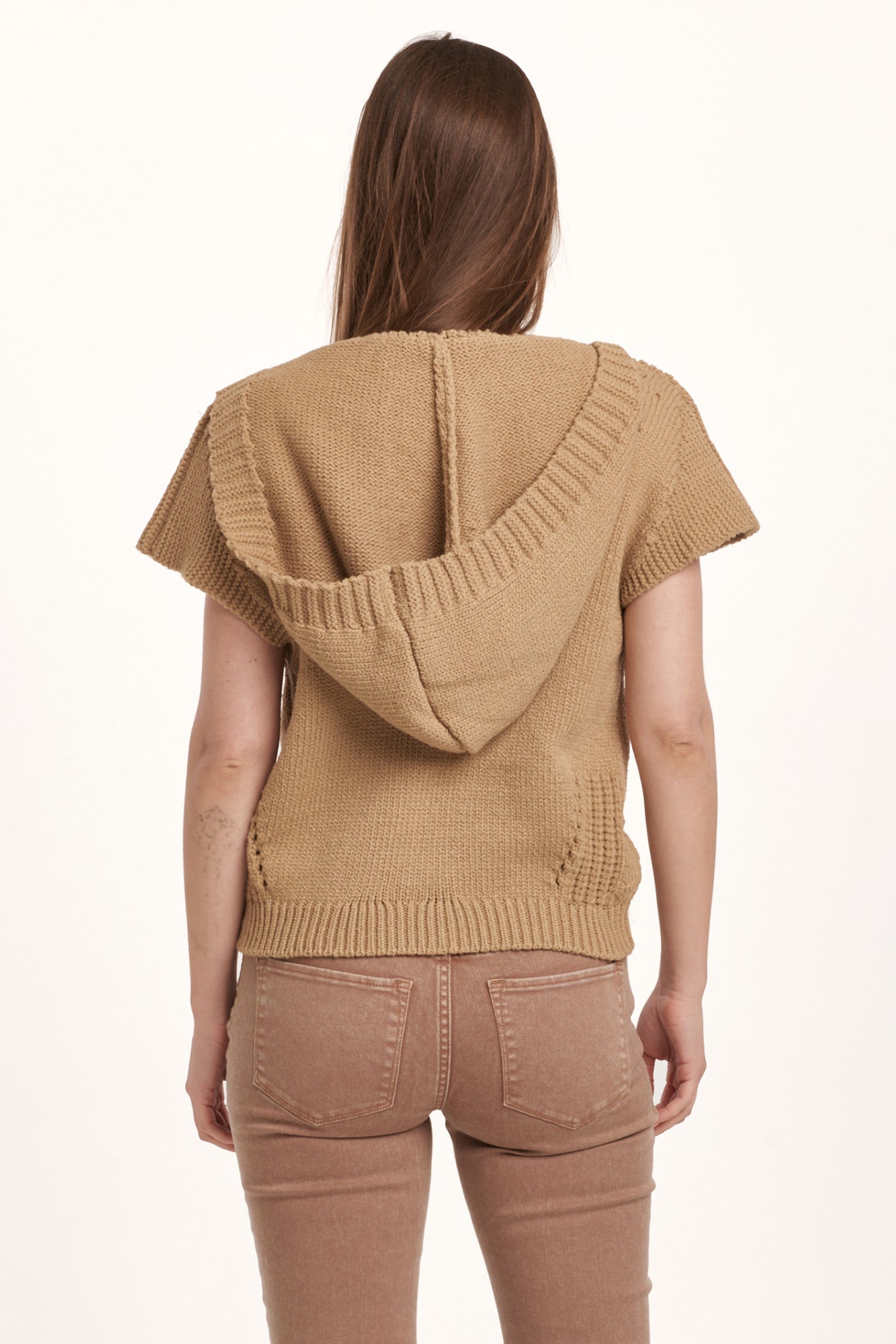 Stay cozy with our Dear John Emira sweater! This hooded, sleeveless, and relaxed fit sweater will keep you warm and stylish during those chilly days. Don't miss out on this unique addition to your wardrobe. (Sweater weather, anyone?)