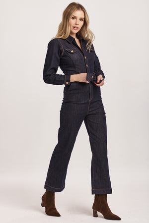 Introducing Dear John's Kellie jumpsuit - the perfect balance of style and comfort! With its v-neck and long sleeves, this jumpsuit is versatile and can be dressed up or down