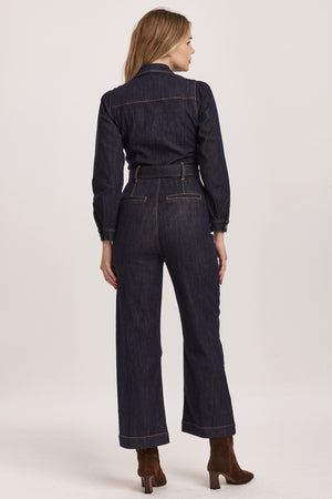 Introducing Dear John's Kellie jumpsuit - the perfect balance of style and comfort! With its v-neck and long sleeves, this jumpsuit is versatile and can be dressed up or down