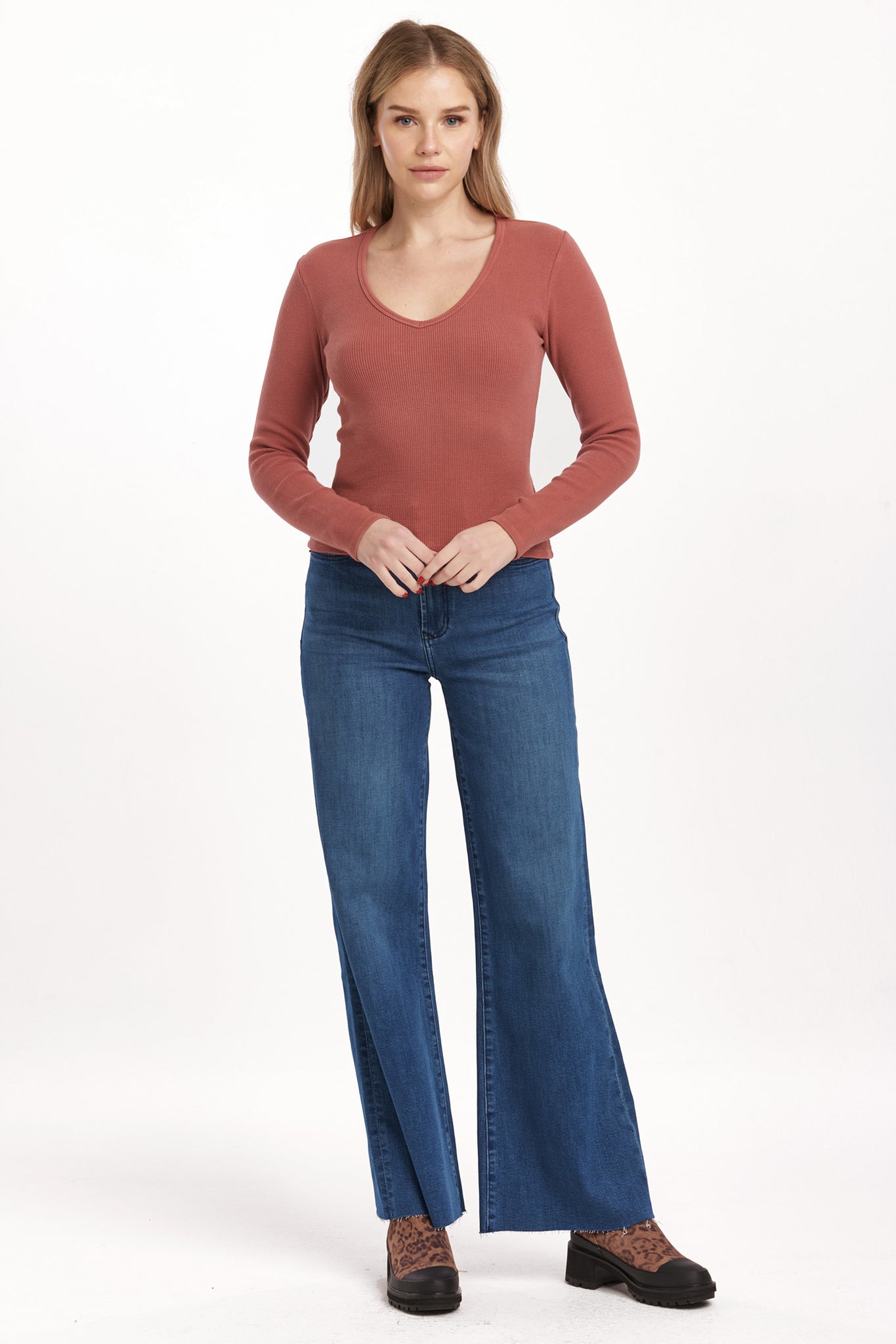 Get ready to rock the v-neck long fitted sleeve top from Dear John's Marlowe collection. This top is perfect for a night out or a casual day in. Embrace your curves with the fitted silhouette and show off your playful side with the v-neckline. (Warning: may cause compliments.)