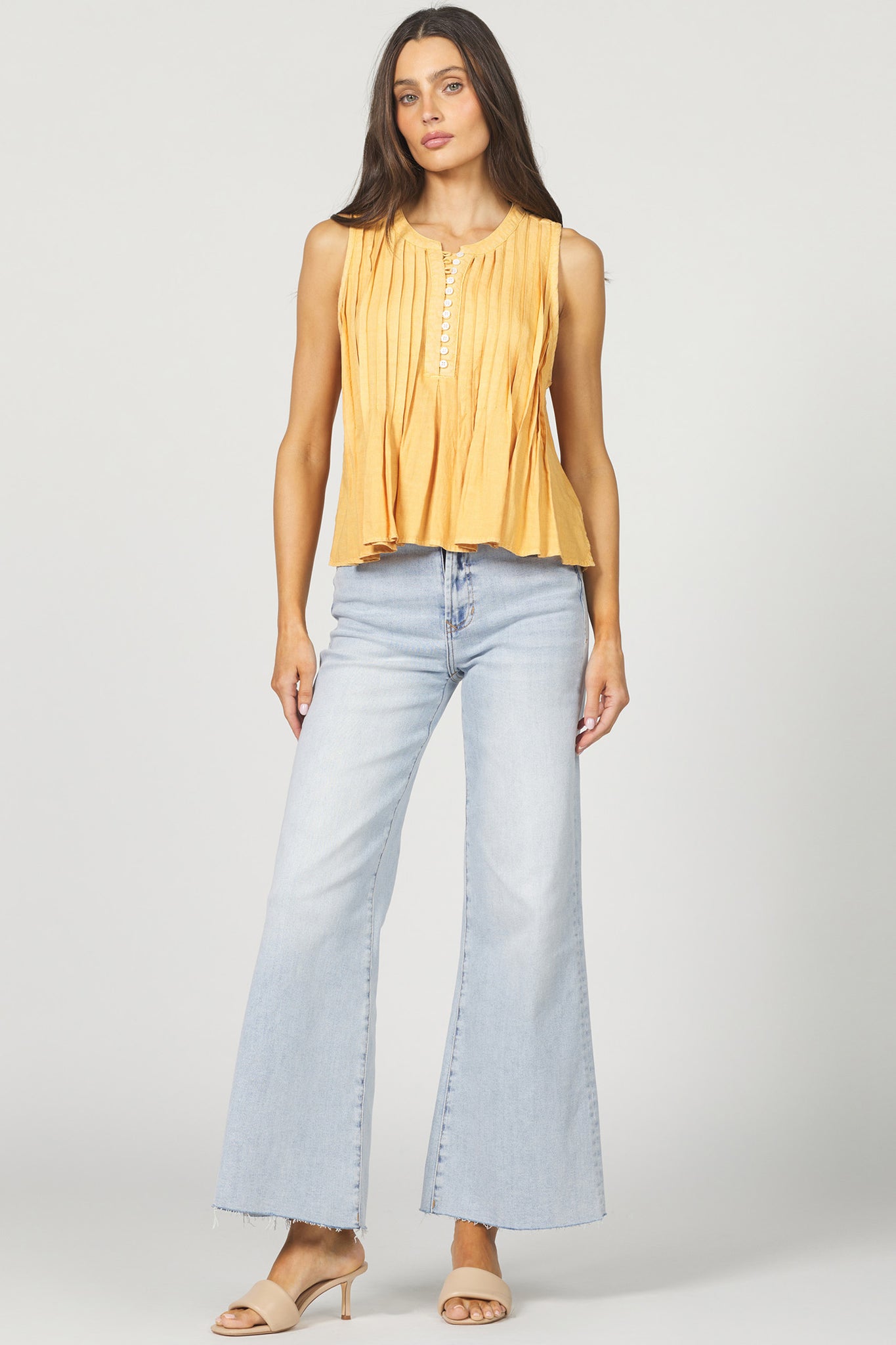 Slip into the Dear John Myron for effortless style on casual days. This sleeveless button-up features a relaxed fit that keeps you cool while looking put-together