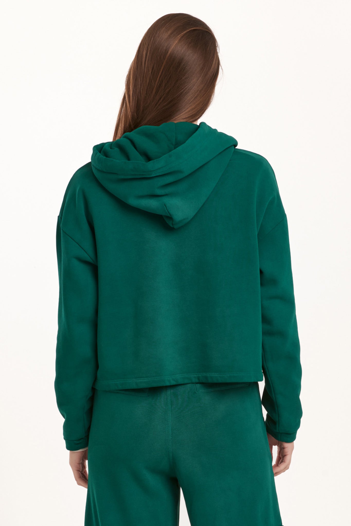 Stay cozy and stylish in our Dear John hooded cropped sweatshirt. Made with a comfortable fit and a playful hood, it's perfect for casual days or nights in. With a unique cropped design, this sweatshirt adds a touch of quirkiness to any outfit. So go ahead, rock that hood and make a statement!