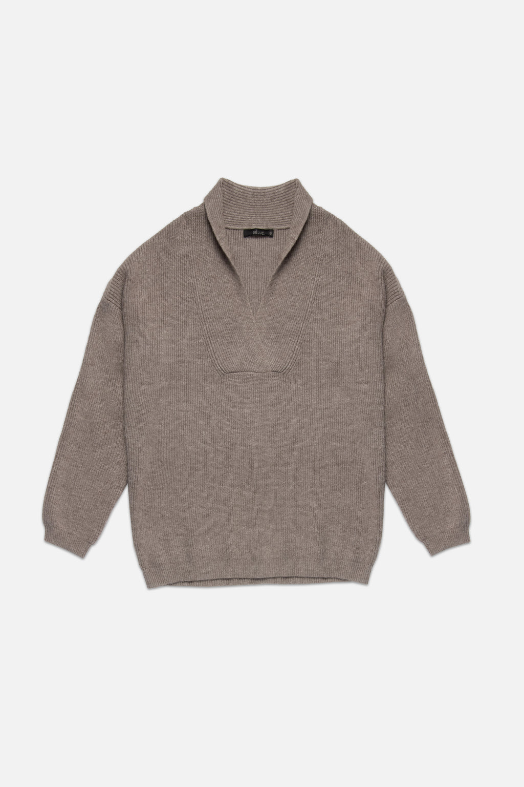 Brown sweater on a light beige background