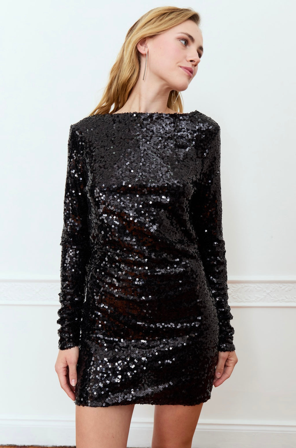 Step out in style with the Deluc Olea Dress! This long sleeve sequin mini dress is the perfect combination of elegance and fun. With its eye-catching sequin detailing, it will have you sparkling all night long. Perfect for any special occasion or night out on the town. (Warning: may attract paparazzi!)