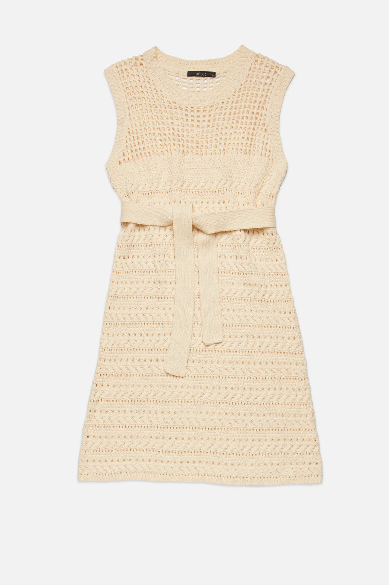 Upgrade your wardrobe with the playful and versatile RUI Knit Dress from Deluc. Made with a soft cotton blend, this sleeveless midi dress features a round collar and a unique open work knit design. The detachable belt adds a touch of customization to this quirky and fun dress.