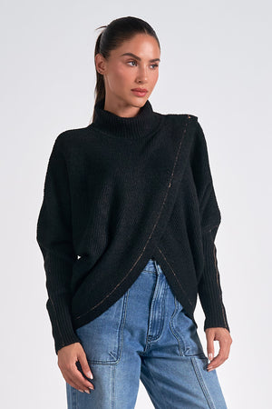 Introducing Elan | Bea cross front mock neck sweater - the perfect blend of style and comfort. Keep warm and turn heads with this quirky and playful addition to your wardrobe. Don't just make a statement, make a double statement with this unique piece.