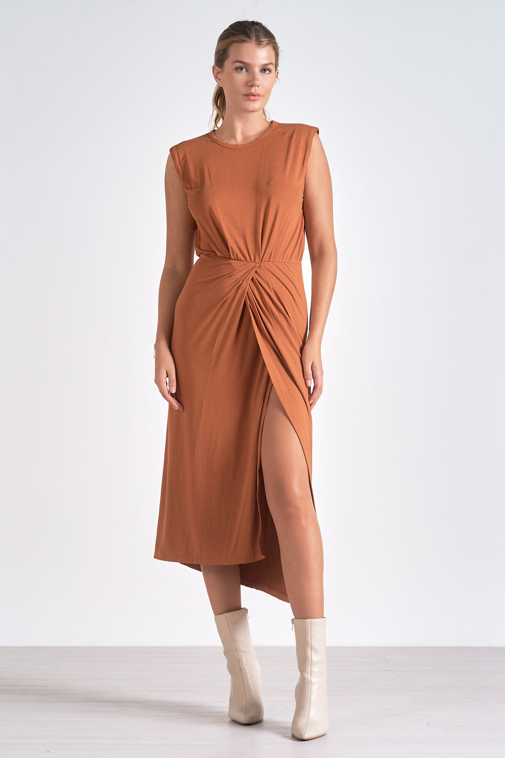 The Lenox dress lets you float through your day in sleeveless midi elegance. A front slit and cinching detail flatter the figure, while buttery-soft fabric ensures all-day comfort.