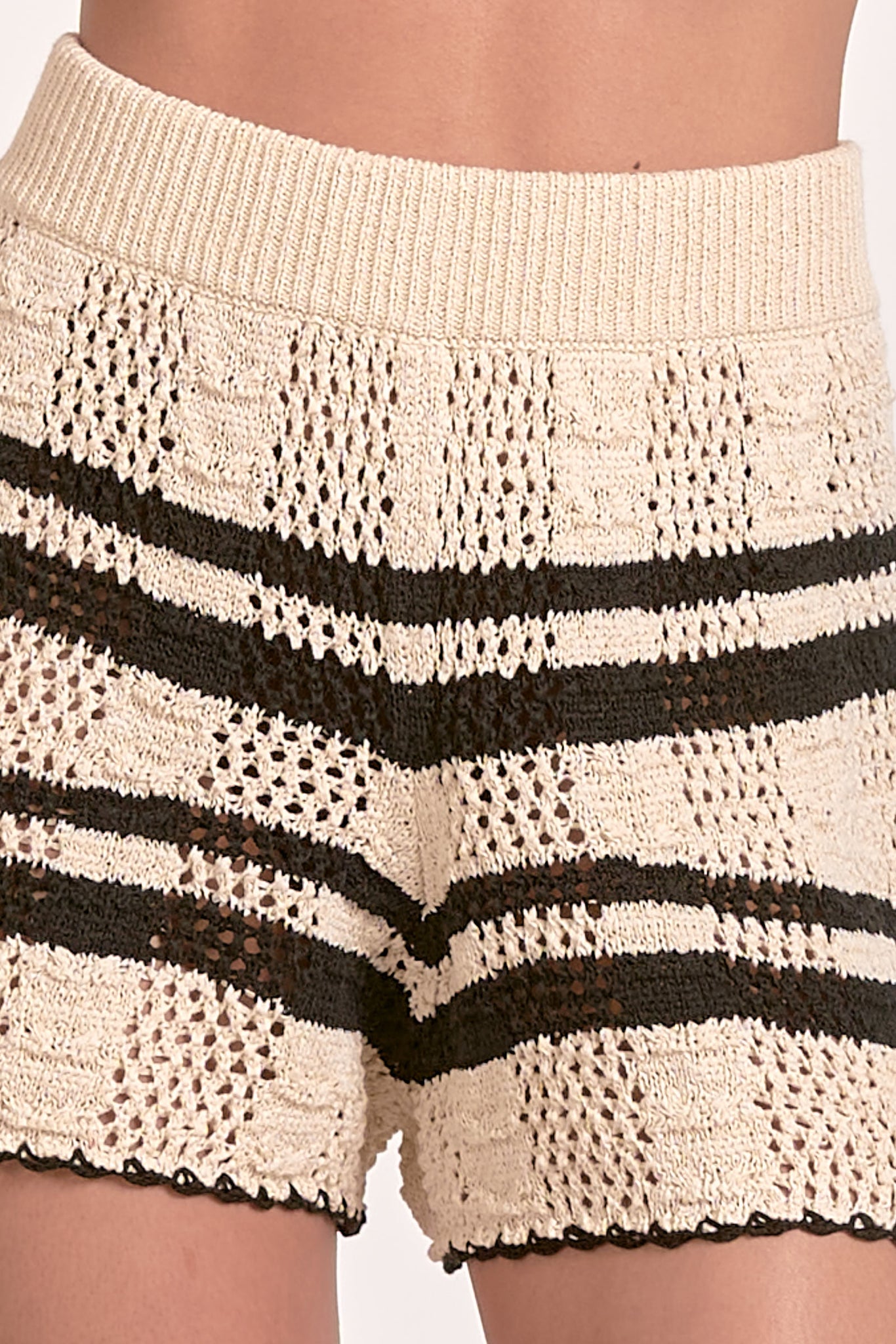 Slip into the Elan Sasha knit short for instant comfort with a side of sass! These playful bottoms are perfect for lounging, brunching, or showing off those legs while keeping things casual-cool. Soft fabric hugs in all the right places without cramping your style or your dance moves!